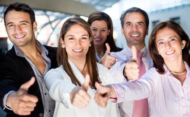 Business team with thumbs up